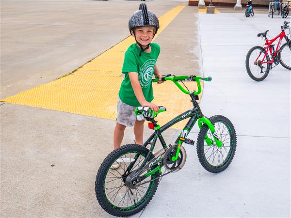 Students bike to school in the morning.